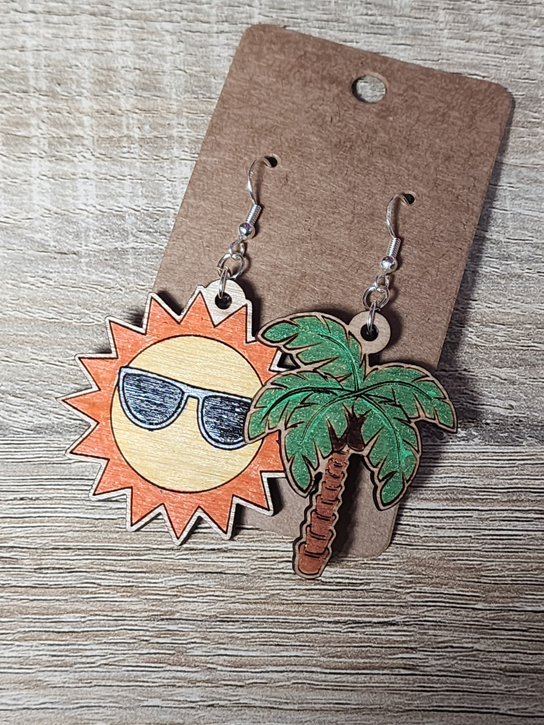 Palm tree and sun asymmetrical dangle