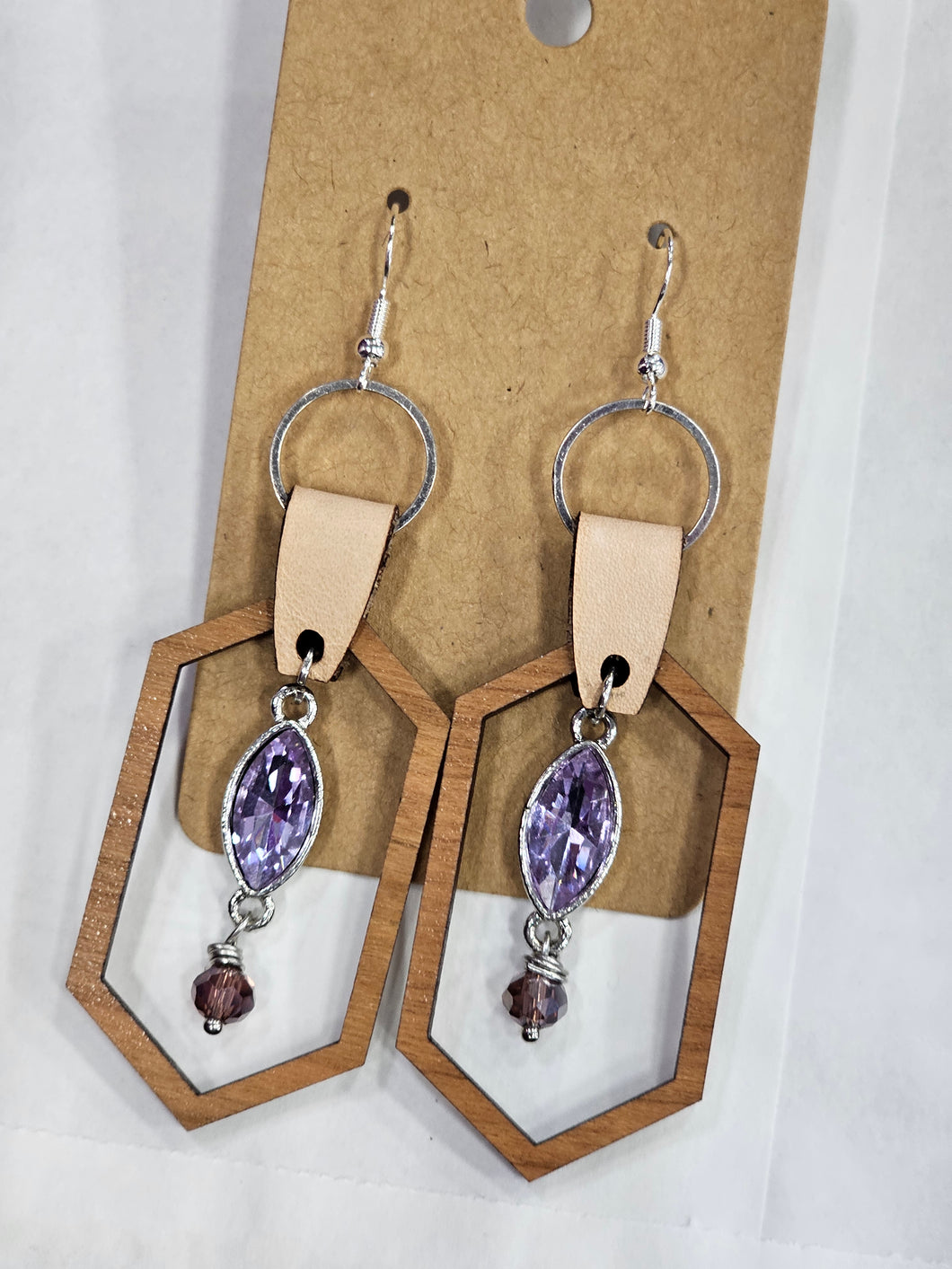 Leather cuff with wood and purple charm