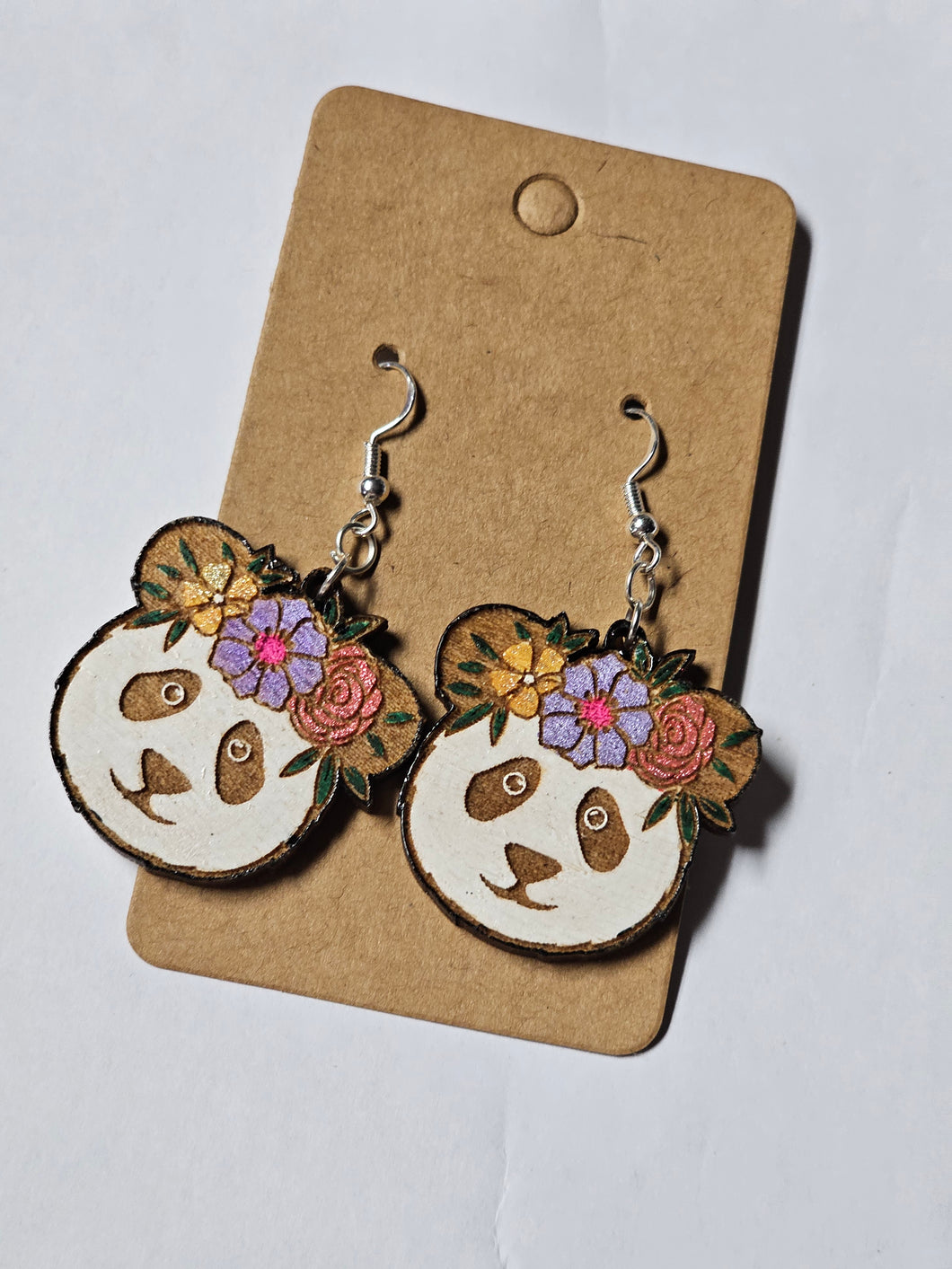 Floral panda, painted wood.