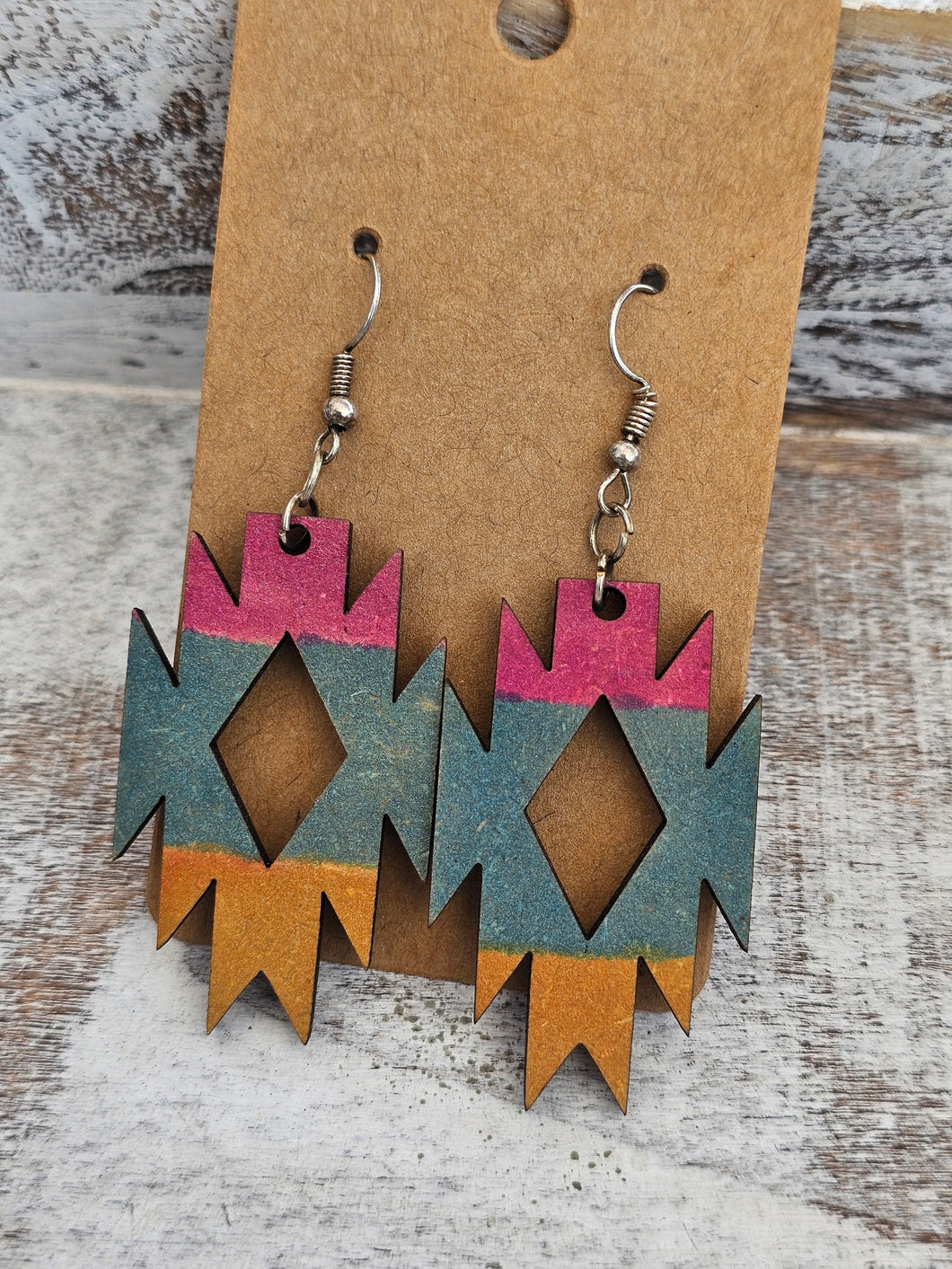 Pink, blue, yellow painted wood