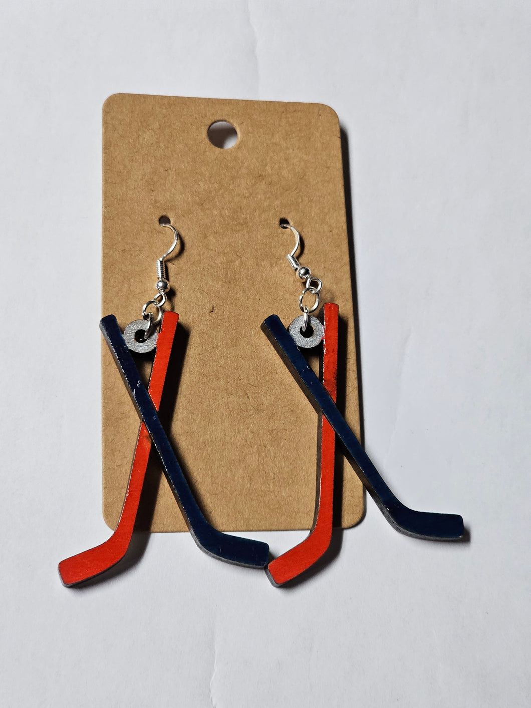 Red and blue hockey sticks, CBJ inspired painted wood