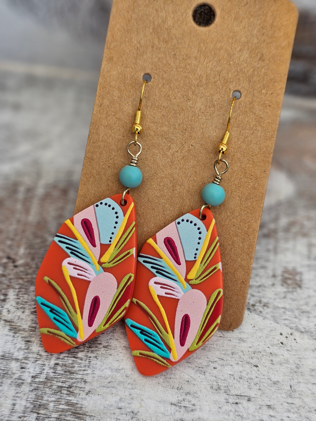 Orange floral acrylic with teal connector