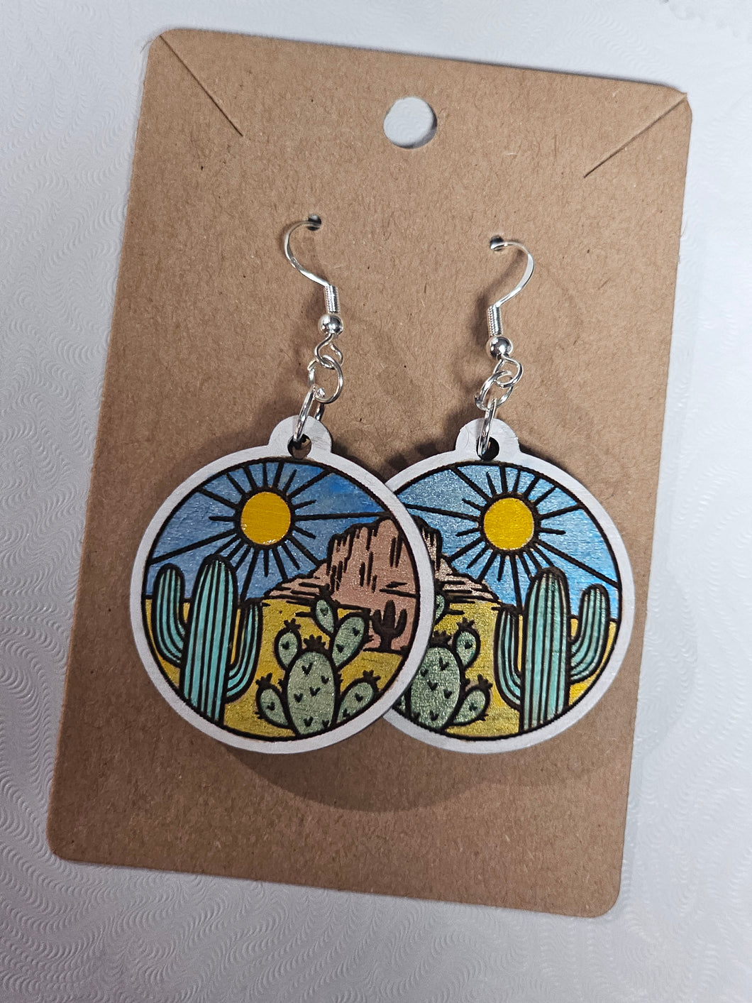 Painted wood, round desert scene