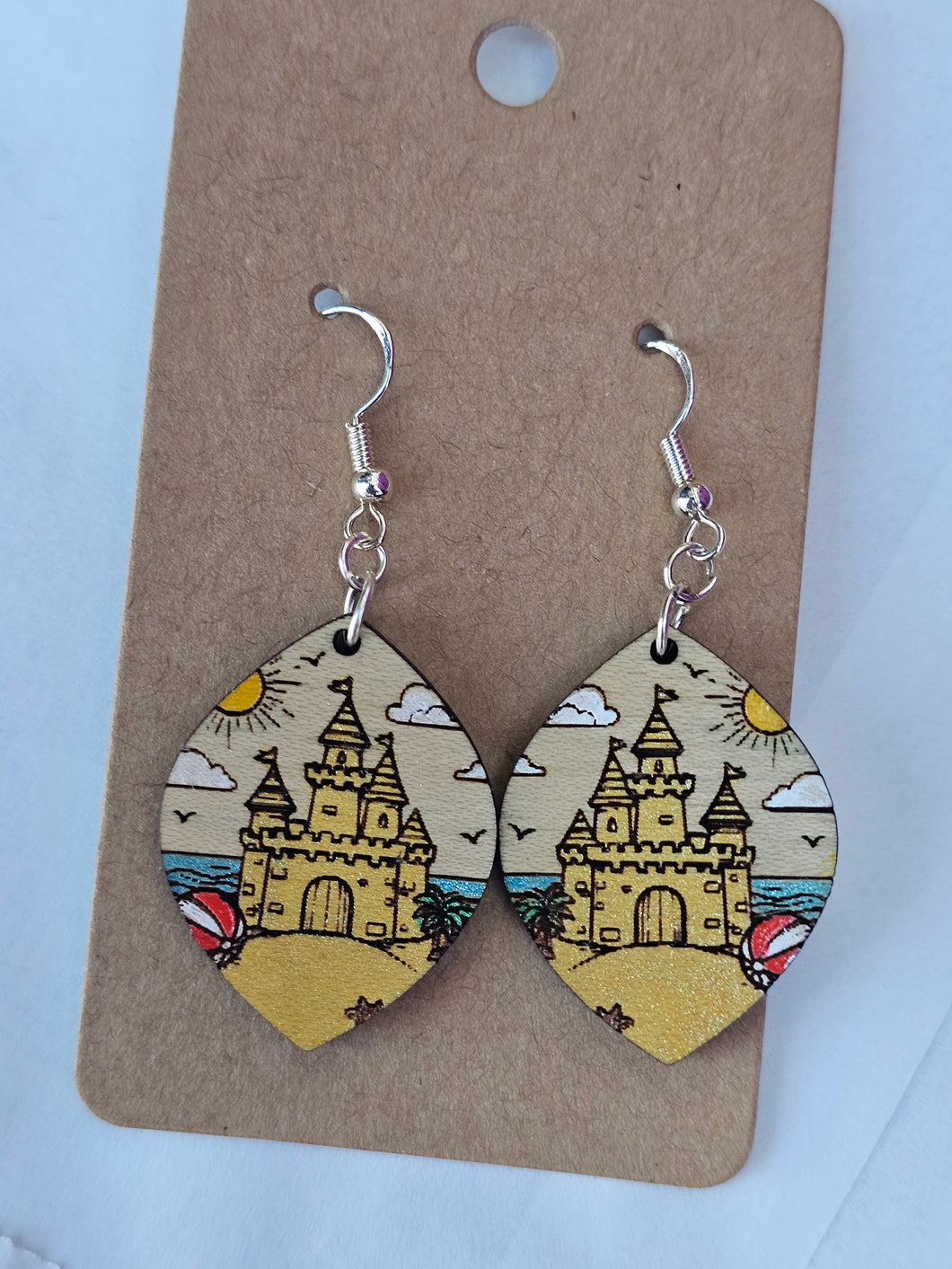 Painted wood, sandcastle on the beach