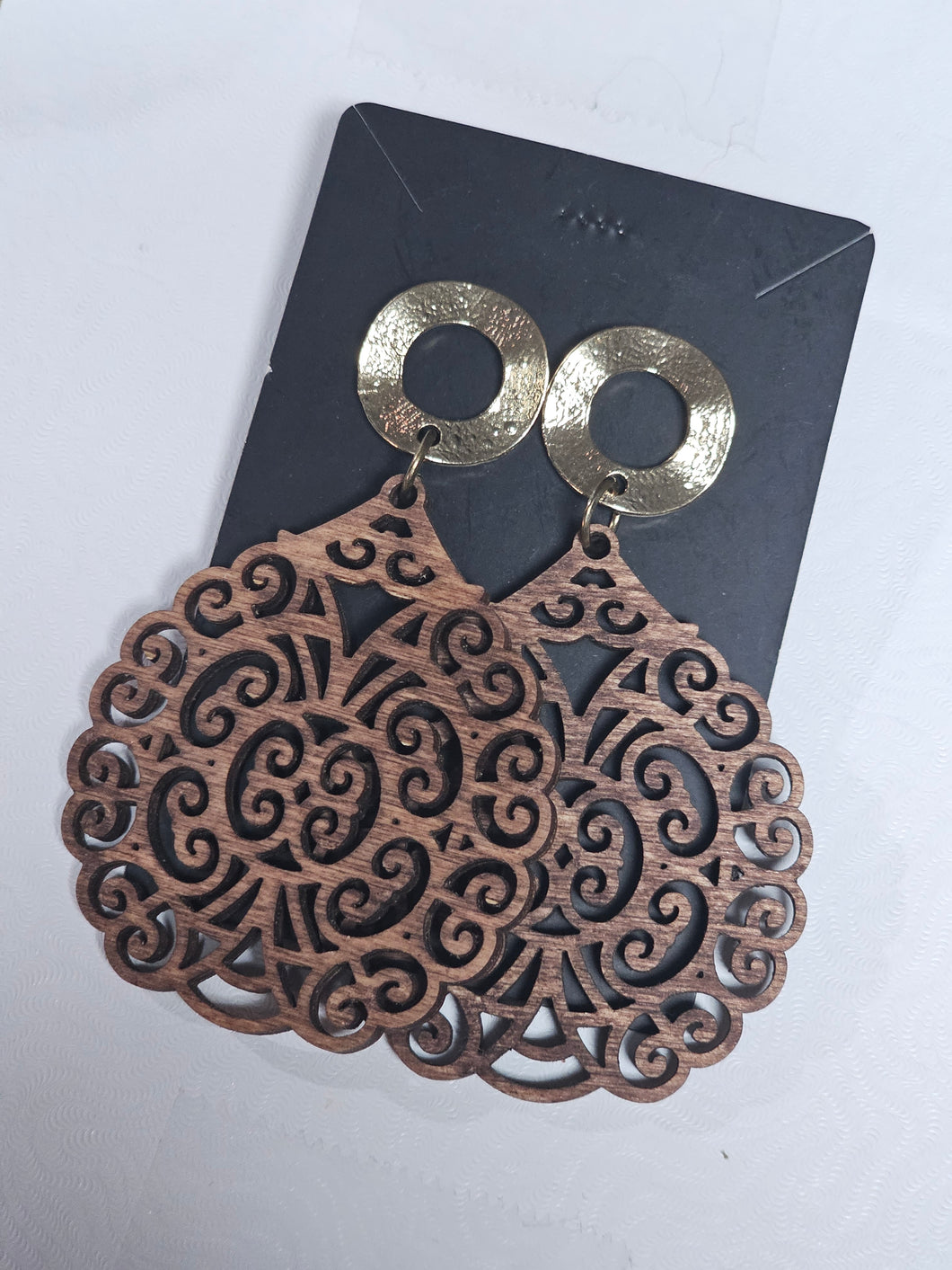 Brown radial scroll with gold post