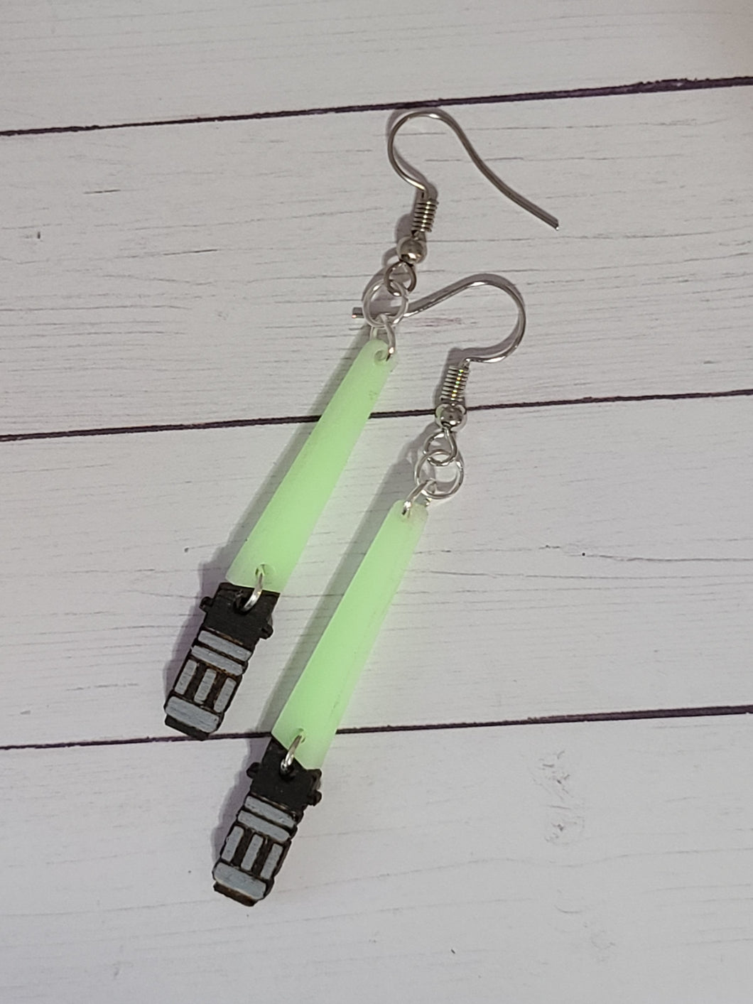 Glow in the dark light saber earrings